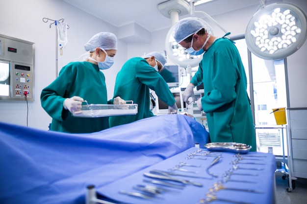 Surgeons performing operation in operation theater