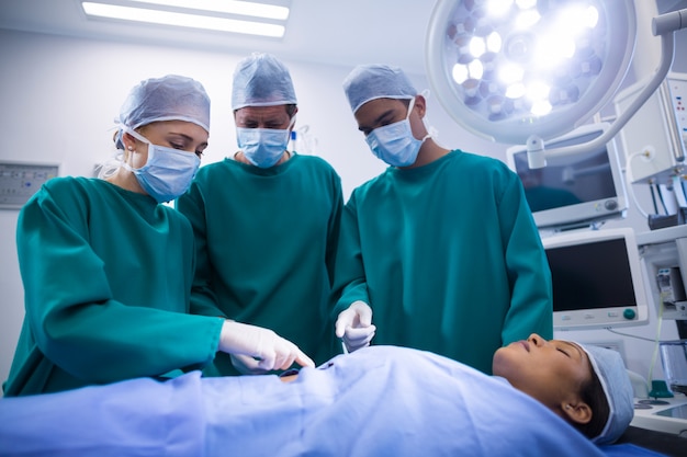 Surgeons performing operation in operation theater