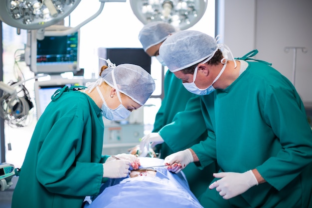 Surgeons performing operation in operation theater