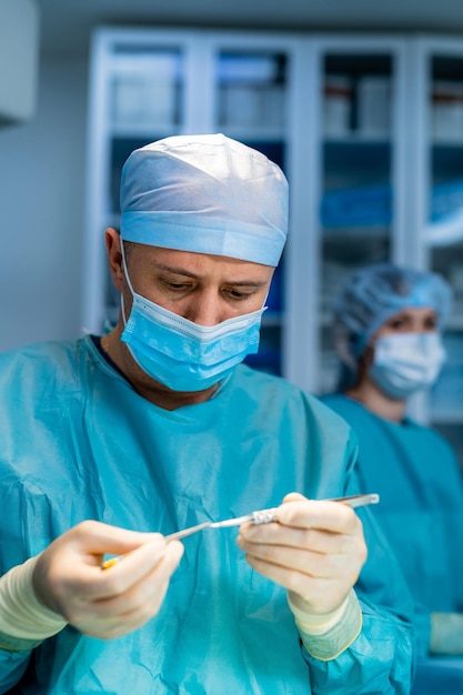 Surgery team operating in a surgical room