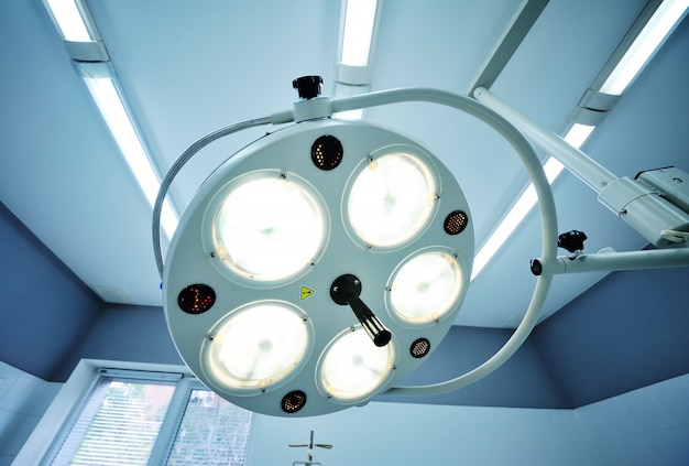 Photo surgical lamp on background of the operating