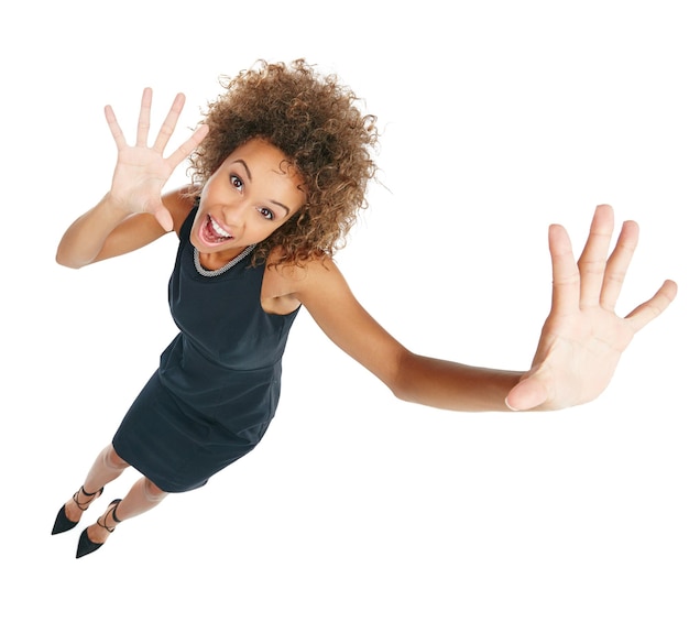 Surprise excited and portrait of a black woman with hands isolated on a white background Shocked smile and above of an African business employee with a confident gesture in a studio