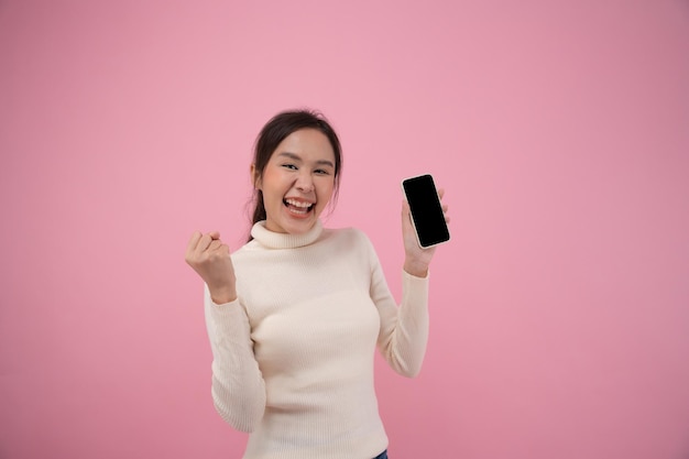 Surprise face wow face woman excited about success on smartphone Screen display on mobile phone show results of successful rewards bonuses get promotions winner wining discount shoppingxA