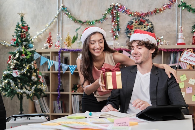 Surprise two coworkers by giving gifts at the Christmas festival