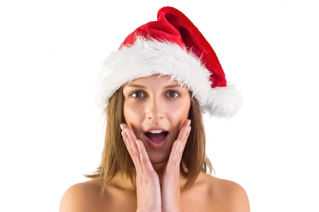 Surprised brunette in santa outfit 