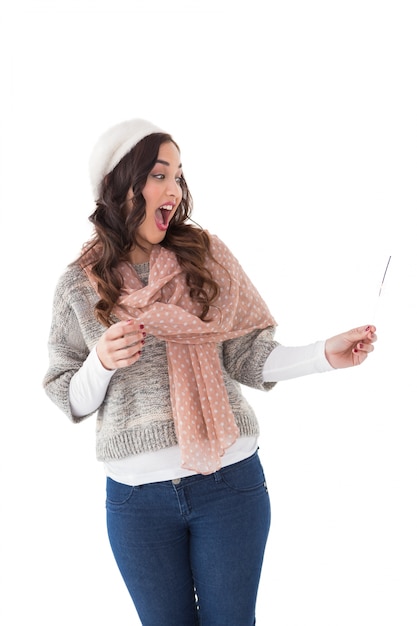 Surprised brunette in winter clothes