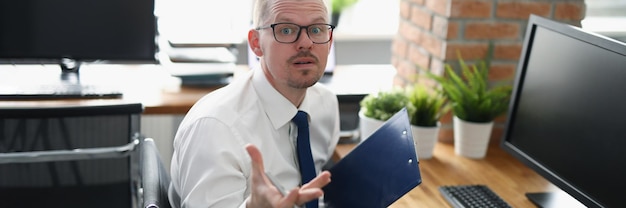 Surprised and desperate clerk in office