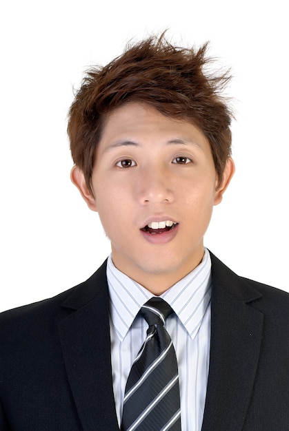 Surprised expression on young Asian executive, closeup portrait.