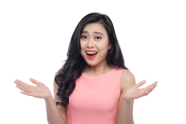 Surprised face of young asian woman over white