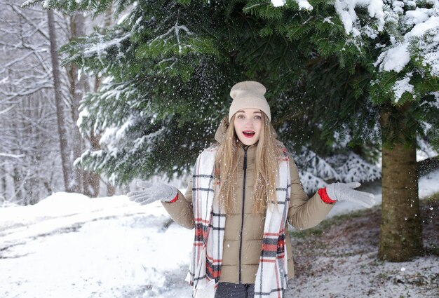 surprised girl in a hat winter