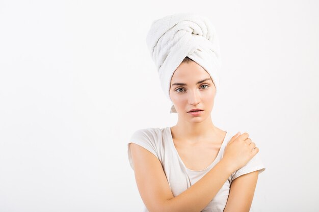 Surprised girl with a towel on her head