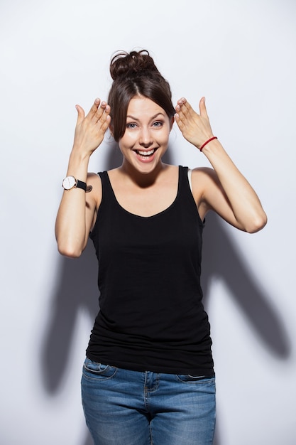 Surprised happy beautiful woman in excitement. Isolated on white background.