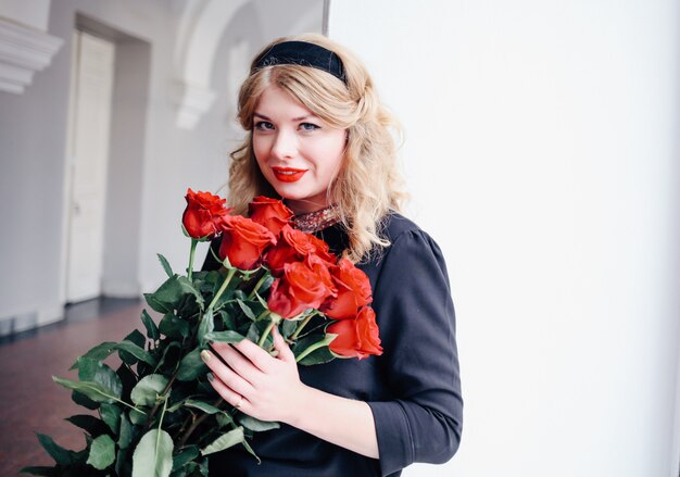 Surprised happy woman receive beautiful bouquet of flowers.