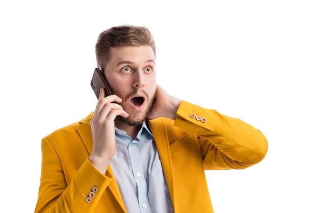 Photo surprised man during phone conversation