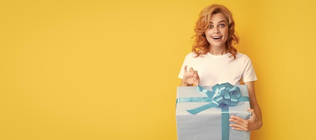 Surprised redhead girl open gift box boxing day Beauty woman isolated face portrait banner with mock