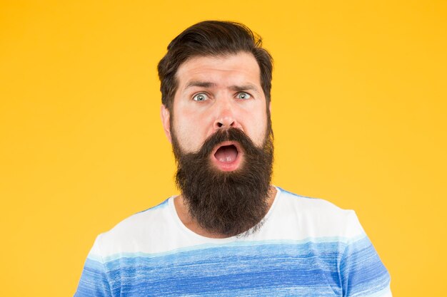 Surprised unshaven man with beard beard and skin care joy and happiness concept portrait of bearded stylish man brutal caucasian guy with moustache mature hipster with beard Male beauty concept