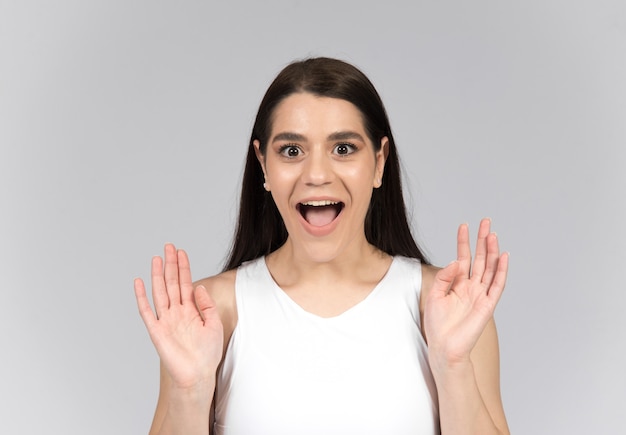 surprised woman isolated on wall