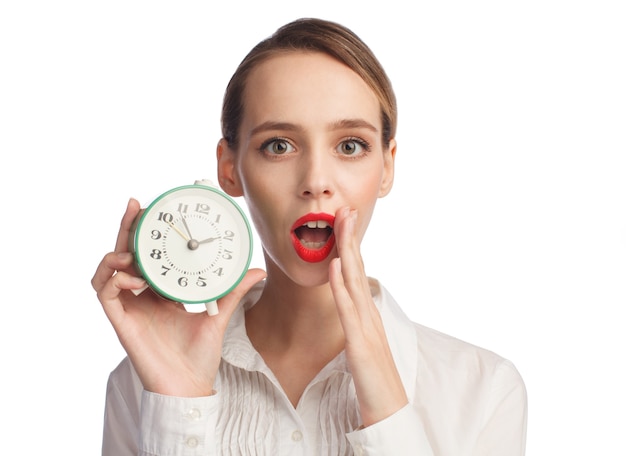 Surprised woman with alarm clock isolated on white background, time management concept