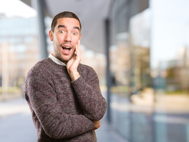 Surprised young man posing