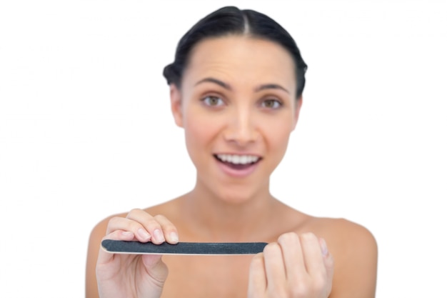 Surprised young model with nail file