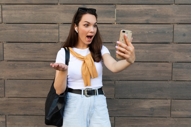 Surprised young woman posing