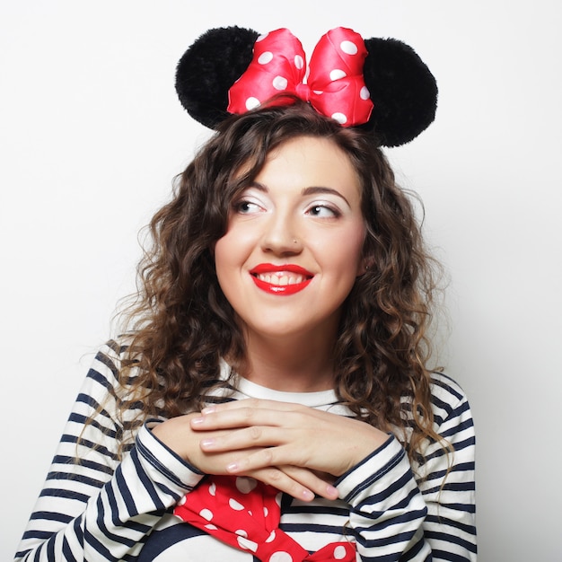 Surprised young woman with mouse ears