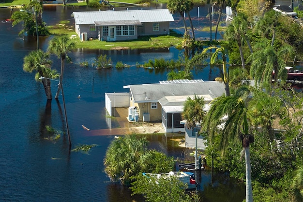 Surrounded by hurricane Ian rainfall flood waters homes in Florida residential area Consequences of natural disaster