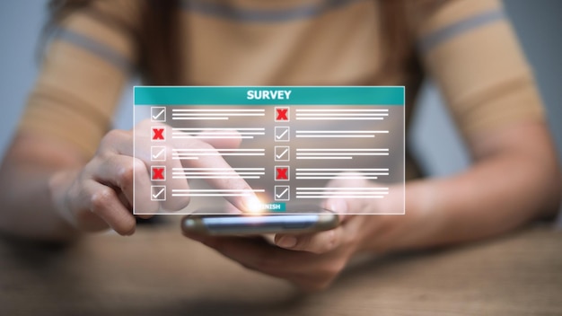 Photo survey form concept check marks on checklist and filling online form or answering questions customer experiences and satisfaction concept