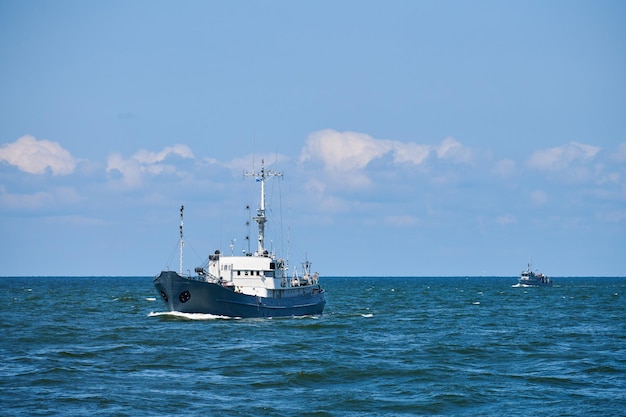 Survey vessel, research vessel patrol boat sailing in bright blue Baltic Sea, navy patrol vessel. Military ship, warship, battleship of Baltic Fleet, Russian Navy