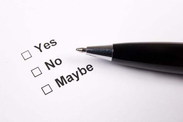 Survey with yes no maybe answers and metal pen