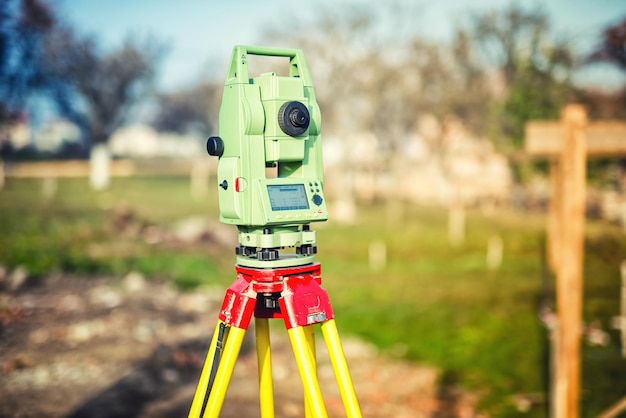 Photo surveyor engineering equipment with theodolite and total station at a construction site