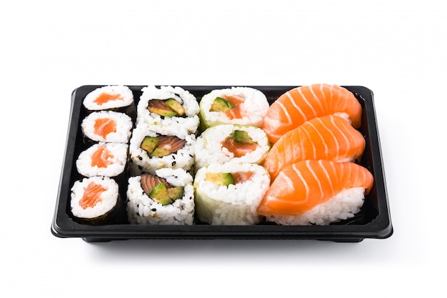 sushi assortment on black tray isolated on white