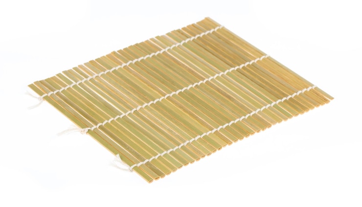 Photo sushi bamboo rolling mat isolated on white background