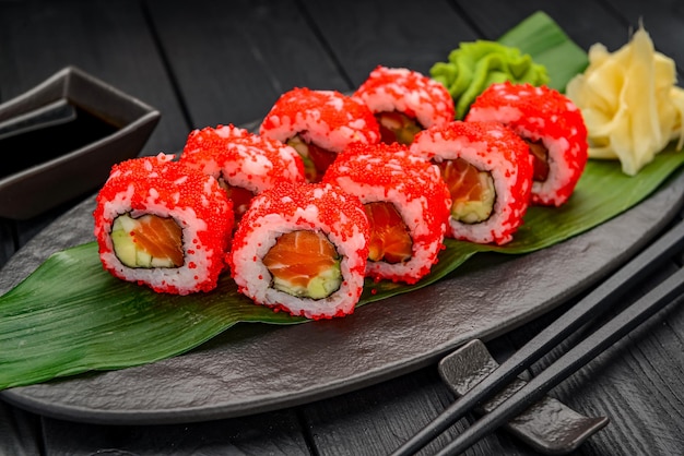 Sushi California rolls with salmon and red tobiko caviar
