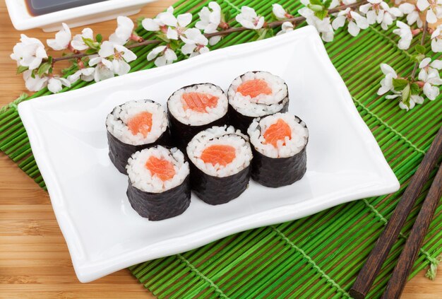 Sushi maki set and sakura branch