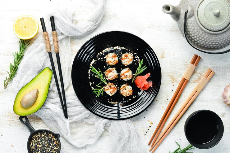Sushi maki with eel rice and Unagi sauce Japanese food set Top view