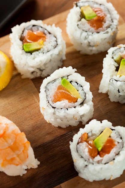 sushi on a plate with avocado