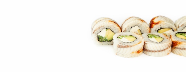 Photo sushi roll black dragon on a white background