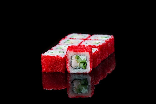 Sushi Roll On A Black surface reflection . Japanese food. Close Up.