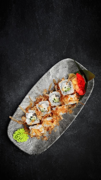 Sushi roll Bonito with eel and tuna on a dark background