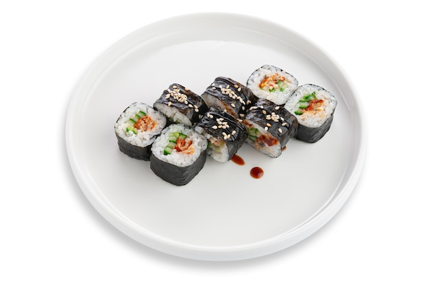Sushi roll with baked salmon, cucumber and sesame seeds. Vegetarian. On a white ceramic plate. White background. Isolated.