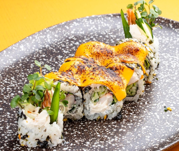 Sushi roll with crab under melted cheese Sushi trend Creative food