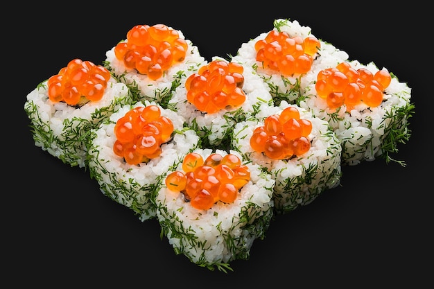 Sushi roll with salmon Philadelphia cheese and red caviar Top view on dark background