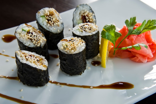 Sushi roll with salmon and shrimp tempura.