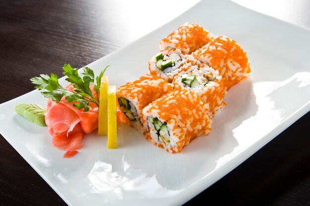 Sushi roll with salmon and shrimp tempura.