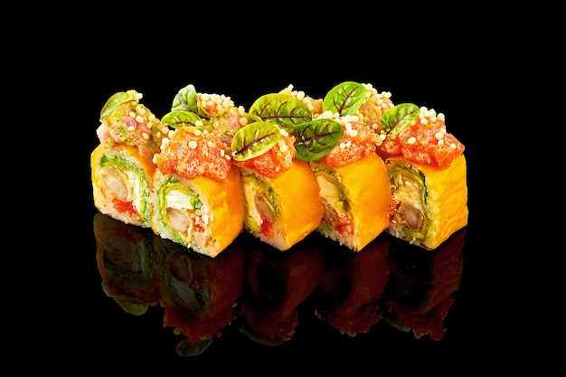 Sushi roll with shrimp cream cheese and salmon on black background