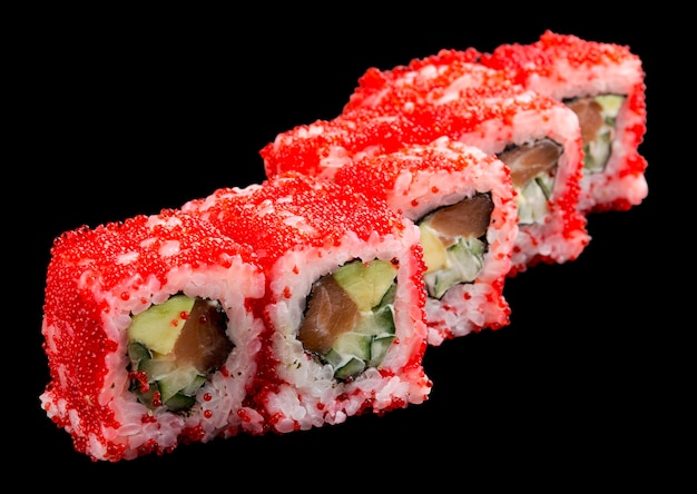 Sushi roll with shrimp and sundried tomatoes in tobiko caviar on black background