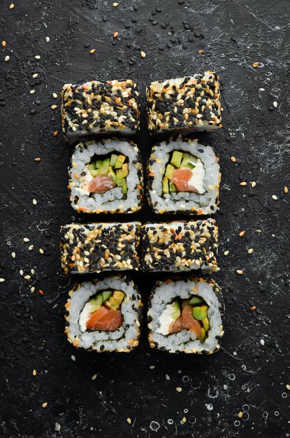 Sushi Rolls California with sesame salmon and avocado Set of sushi rolls of seafood