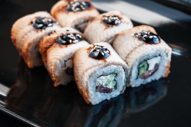 Sushi rolls california with shrimp eel sesame food delivery k closeup