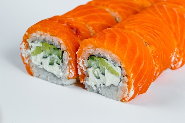 Sushi rolls classic with fresh salmon and cream cheese. Japanese traditional food